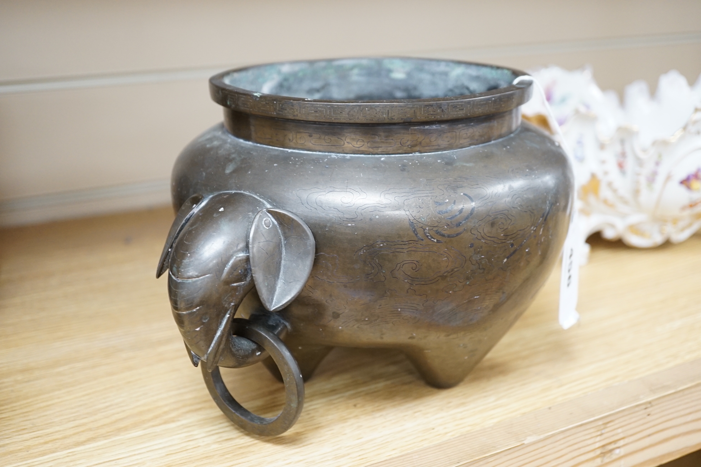 A large Chinese silver inlaid bronze elephant handled censer, signed Sishou, 19th century, 16cms high, 29cm wide